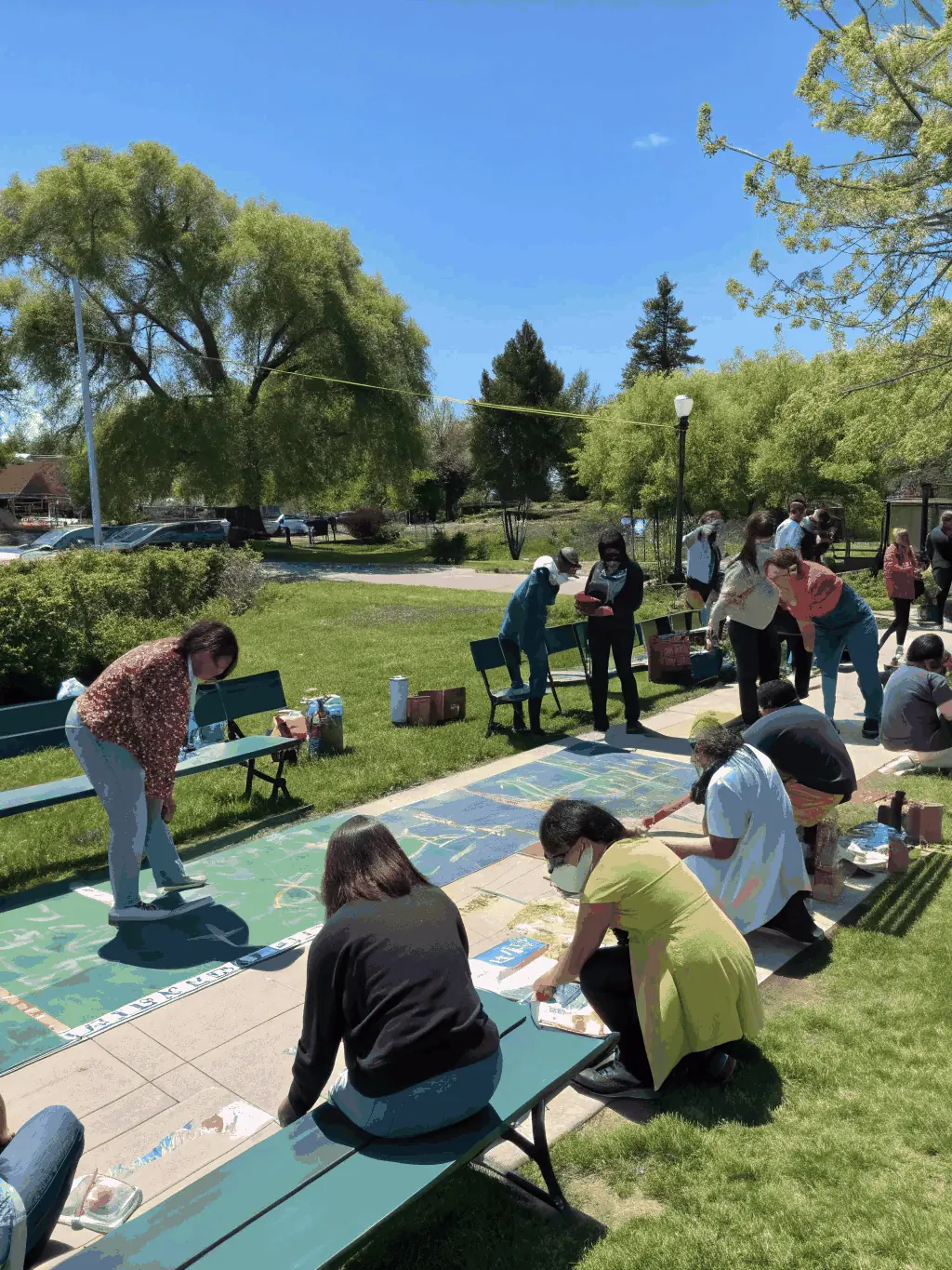 A photograph of a collaborative art installation created by community members and artists, symbolizing unity and shared creativity.
